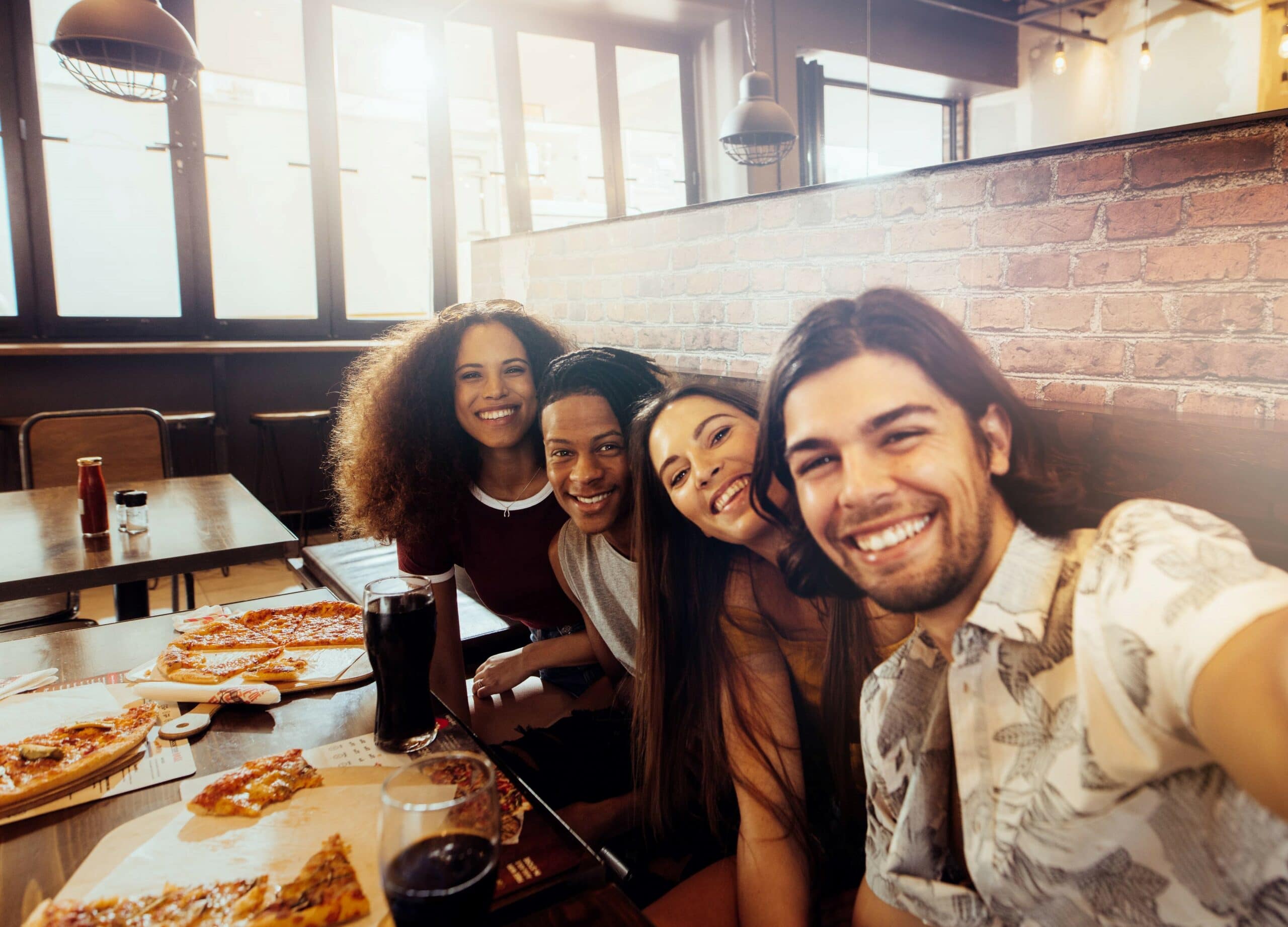 happy group enjoying a pizza restaurant